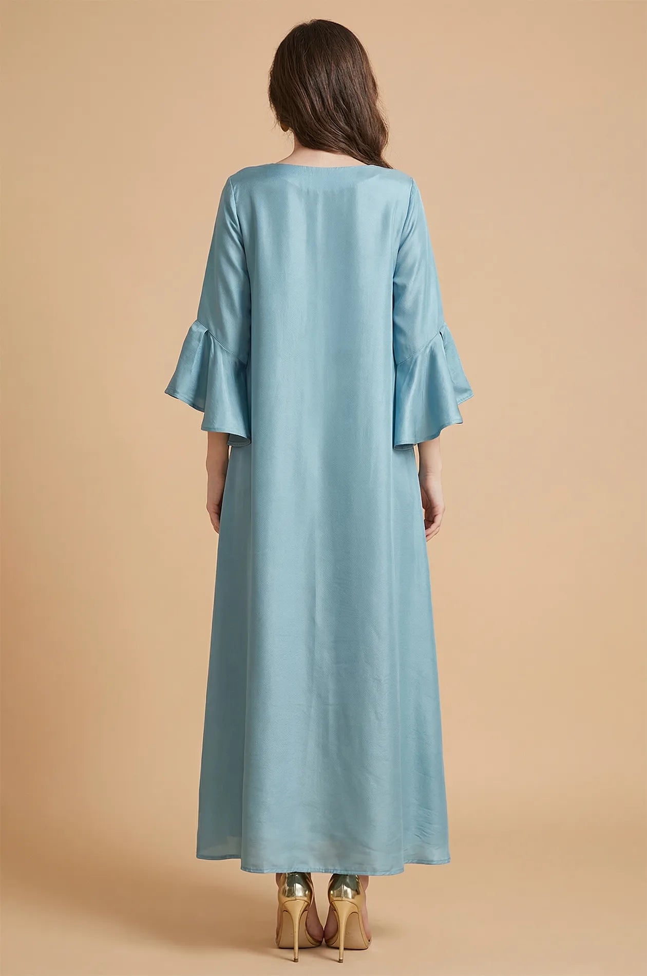Back view of the long-sleeved Alima aqua blue kaftan at Naylara.