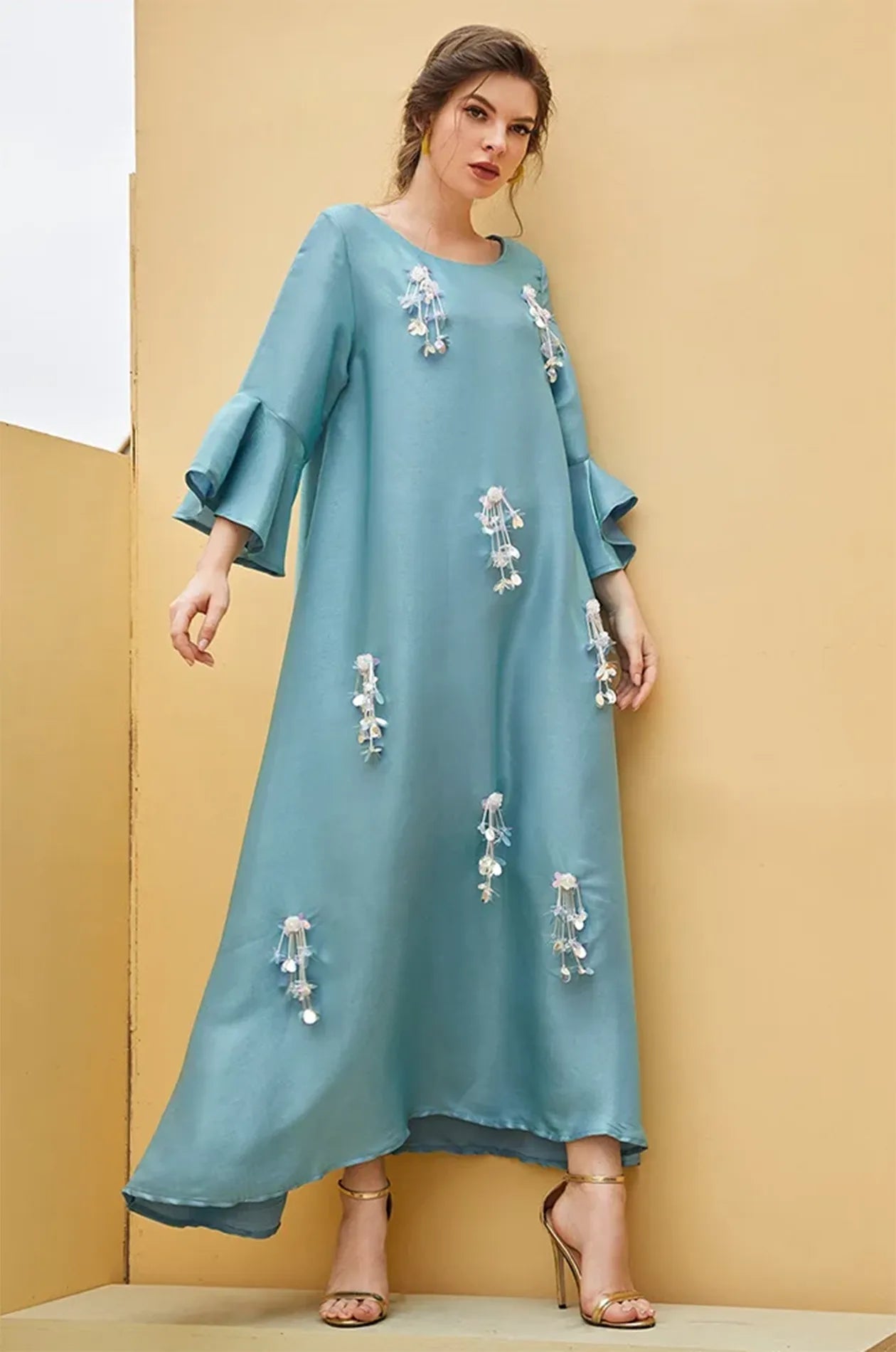 Flowy movement of the Alima aqua blue kaftan satin fabric.