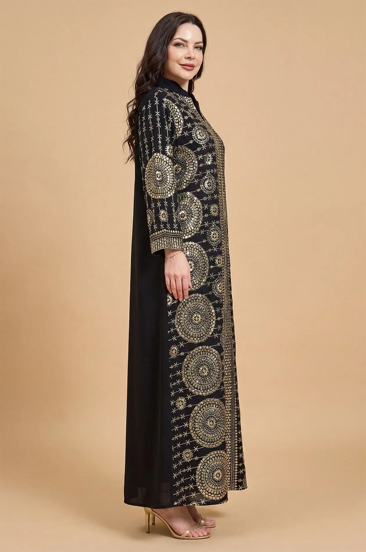 Side profile of the Aluna black mirror kaftan highlighting the elegant drape and long-sleeve gold accents.