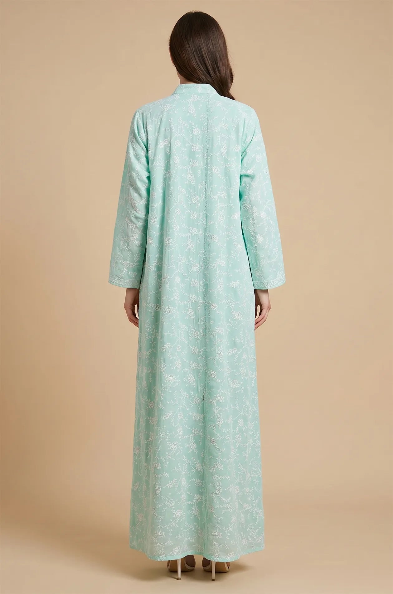 Back view of the Alura Shimmer Kaftan in gray highlighting the seamless floral pattern and floor-length drape.