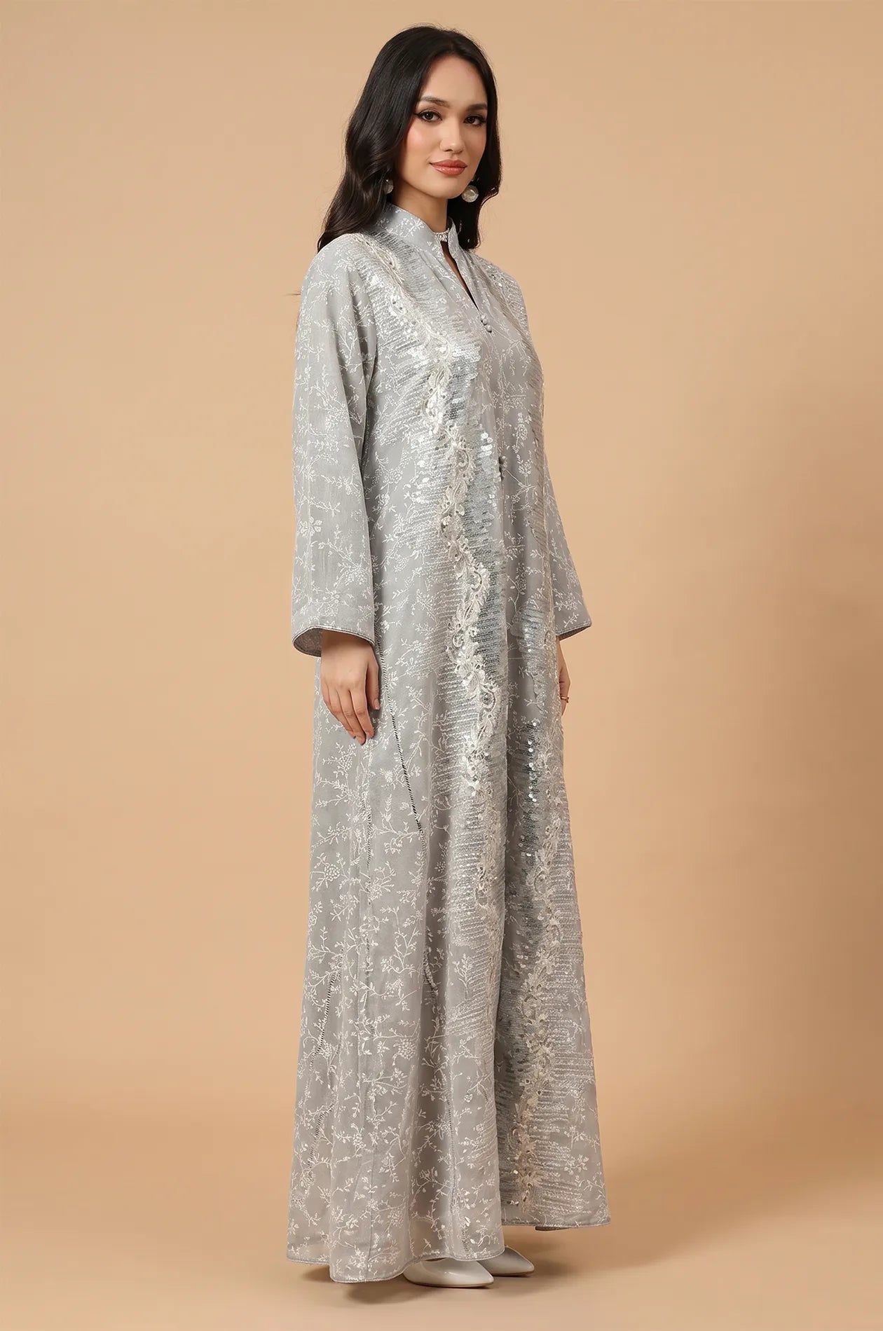 Side profile of the Alura Shimmer Kaftan in gray, showcasing the relaxed fit and detailed sleeve finish.
