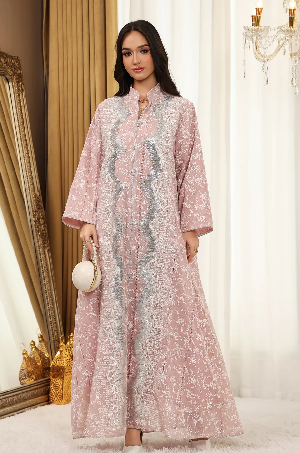 Full-length luxury presentation of the Alura shimmer kaftan in pink with silver accents and refined evening styling.