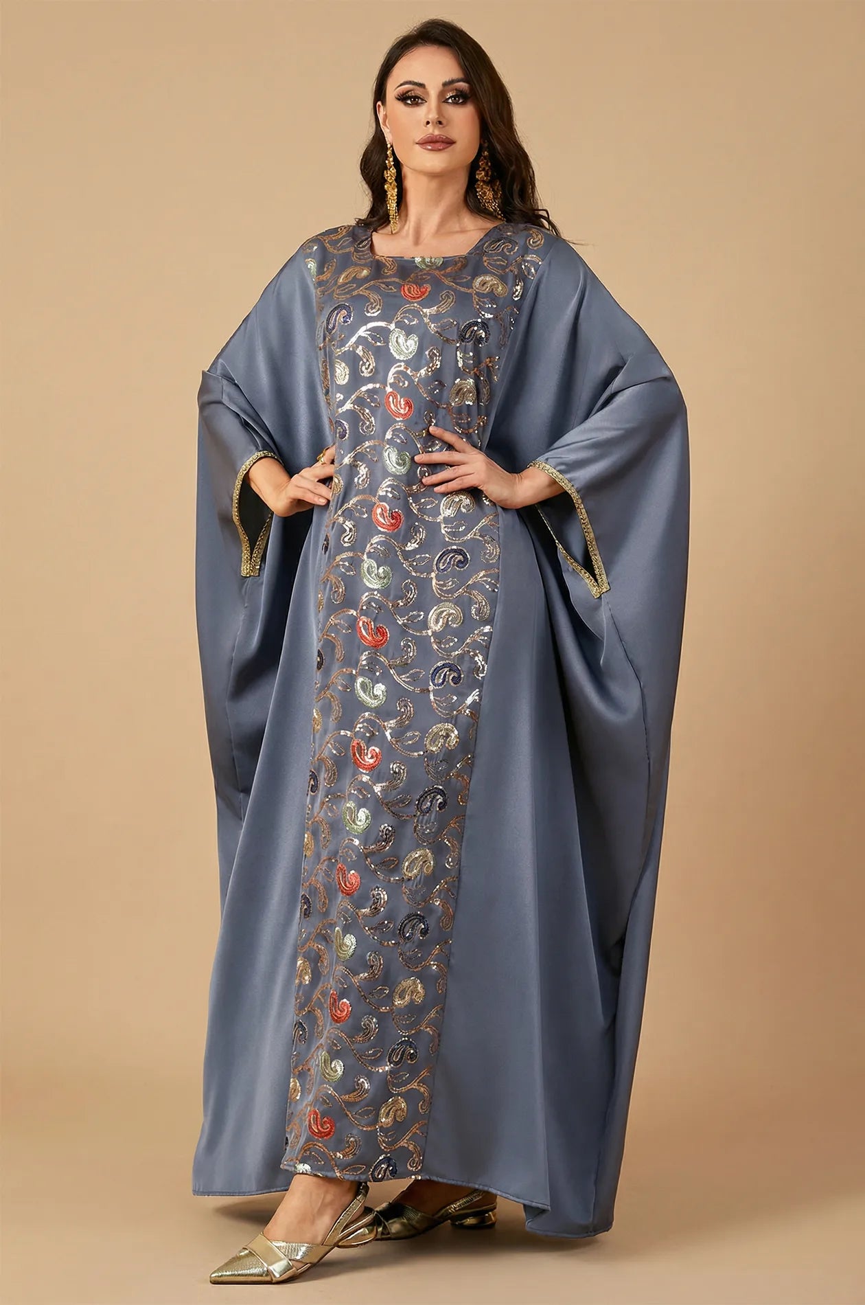 Full-length standing shot of the gray Amiri farasha kaftan on a neutral background for a clear product view.