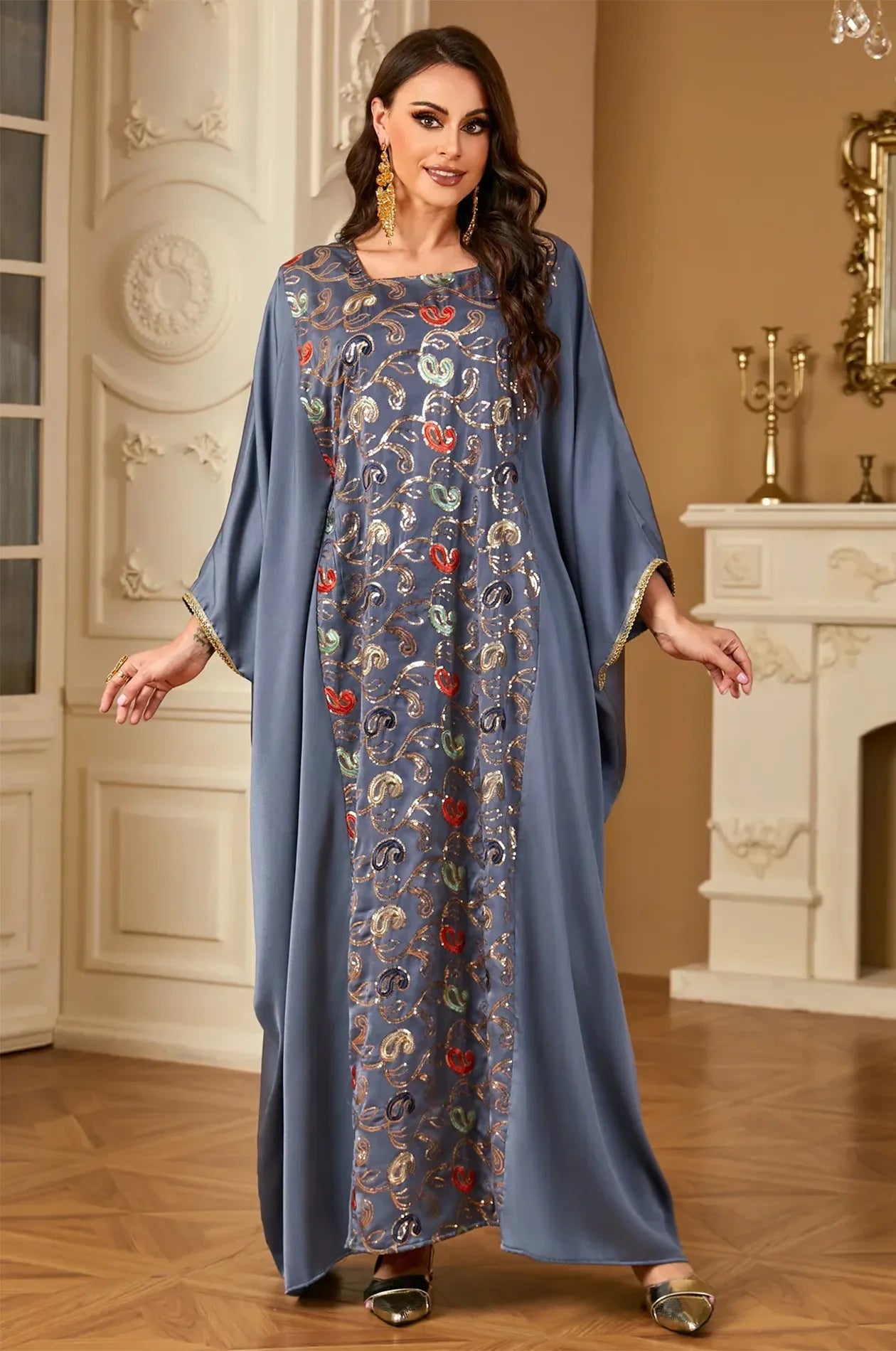 Full front view of the gray Amiri farasha kaftan from Naylara featuring vibrant multi-color sequin paisley patterns.