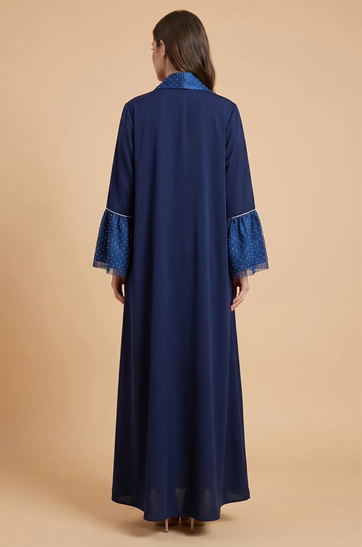 Back view of the Auris Navy Blue solid color Kaftan showing the floor-length modest drape and shimmering collar.