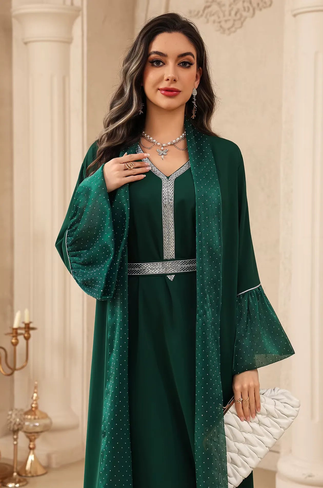 Mid-shot of the Auris Green solid color Kaftan focusing on the rhinestone-encrusted neckline and matching butterfly jewelry accessories.