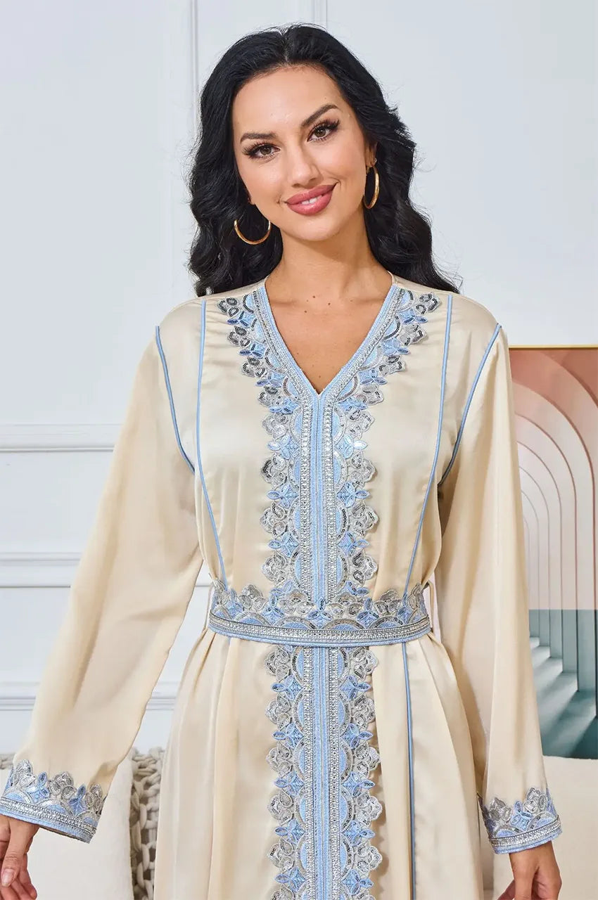 Close-up of light blue Sfifa embroidery and Aakad buttons on Ayana kaftan.