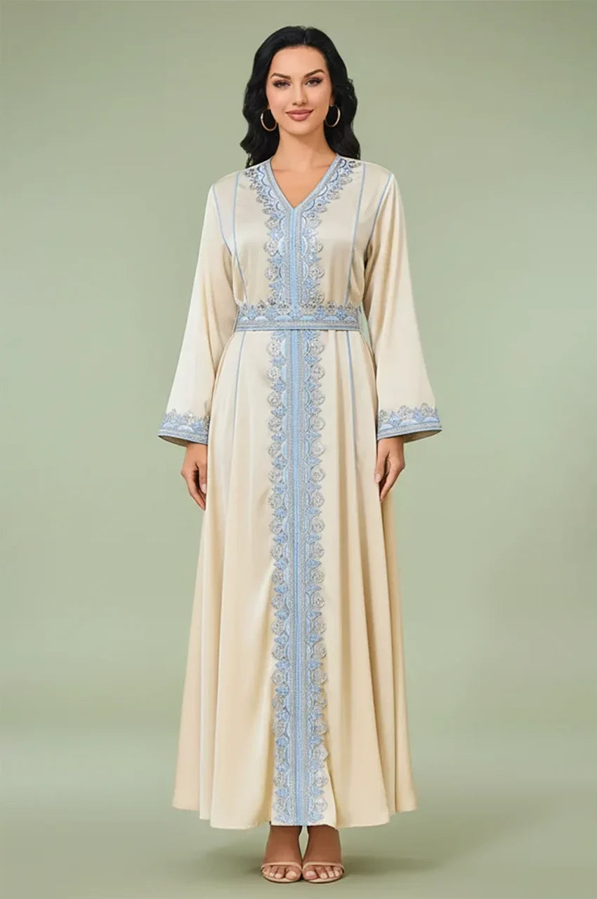 Front view of Ayana long satin kaftan in cream with blue embroidery.