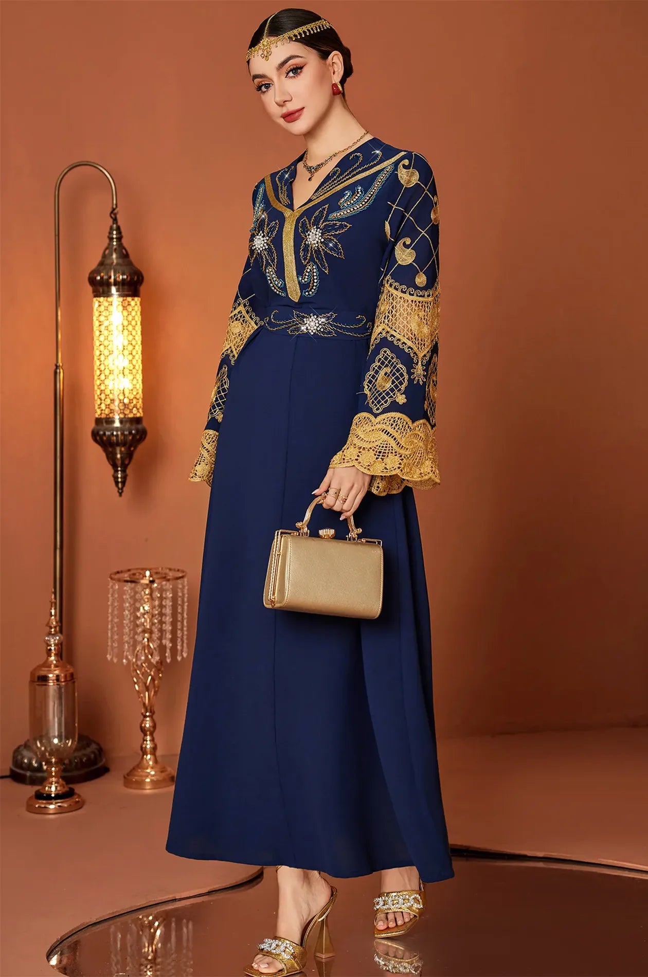 Three-quarter view of the Aysel kaftan showing the intricate bodice embroidery.