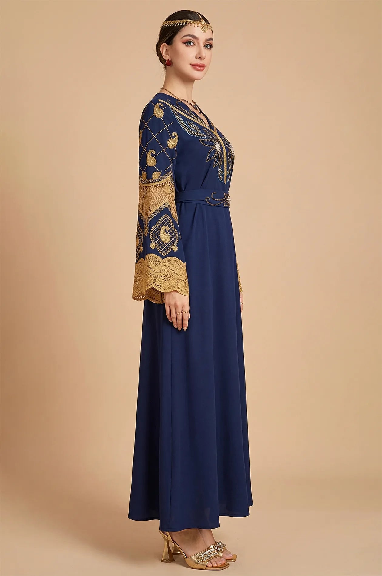 Side profile of the Aysel kaftan highlighting the flared paisley lace bell sleeves.