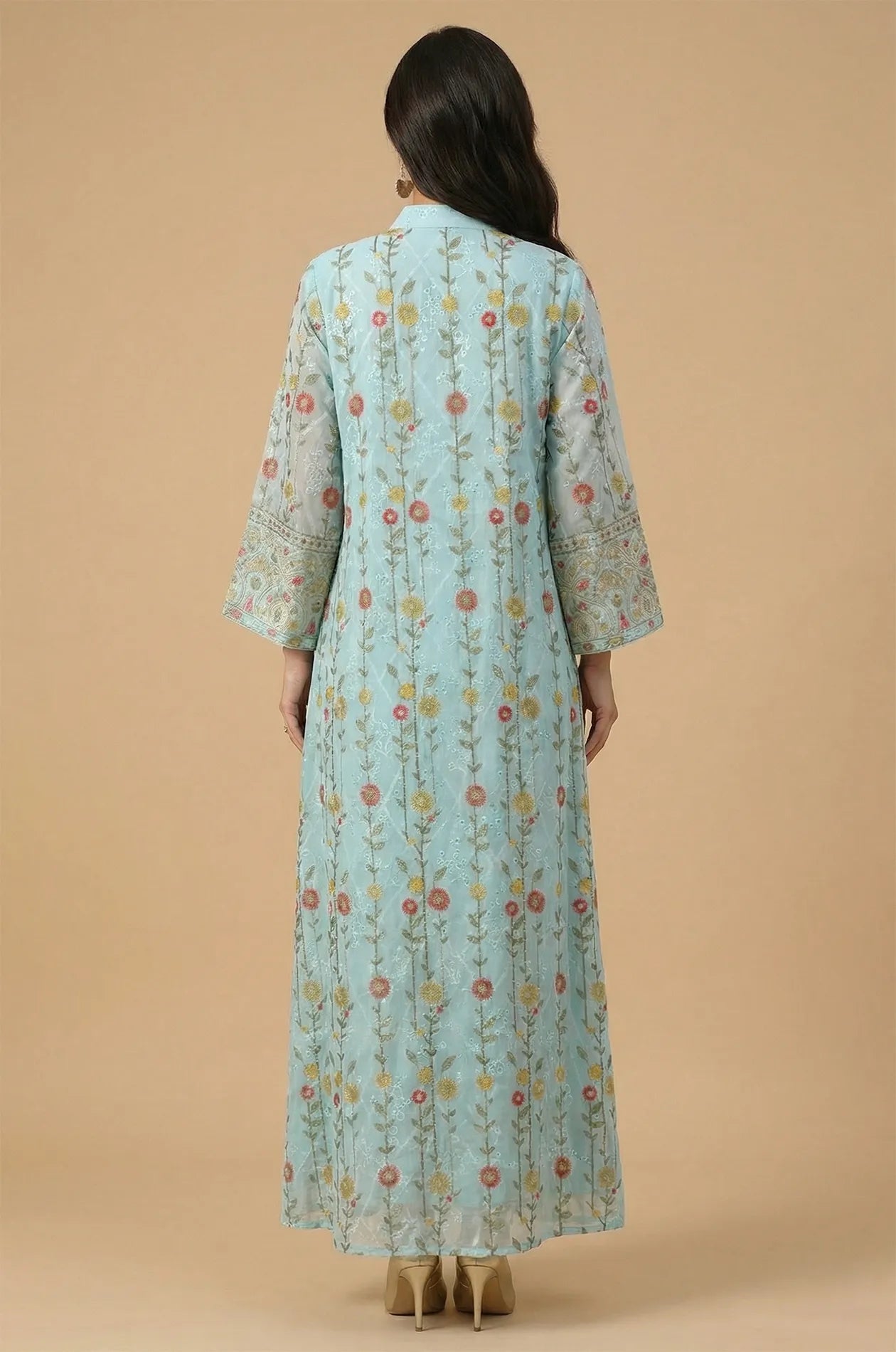 Rear view of the Azari mint green chiffon kaftan maxi dress highlighting the vertical floral vine patterns and floor-length silhouette.