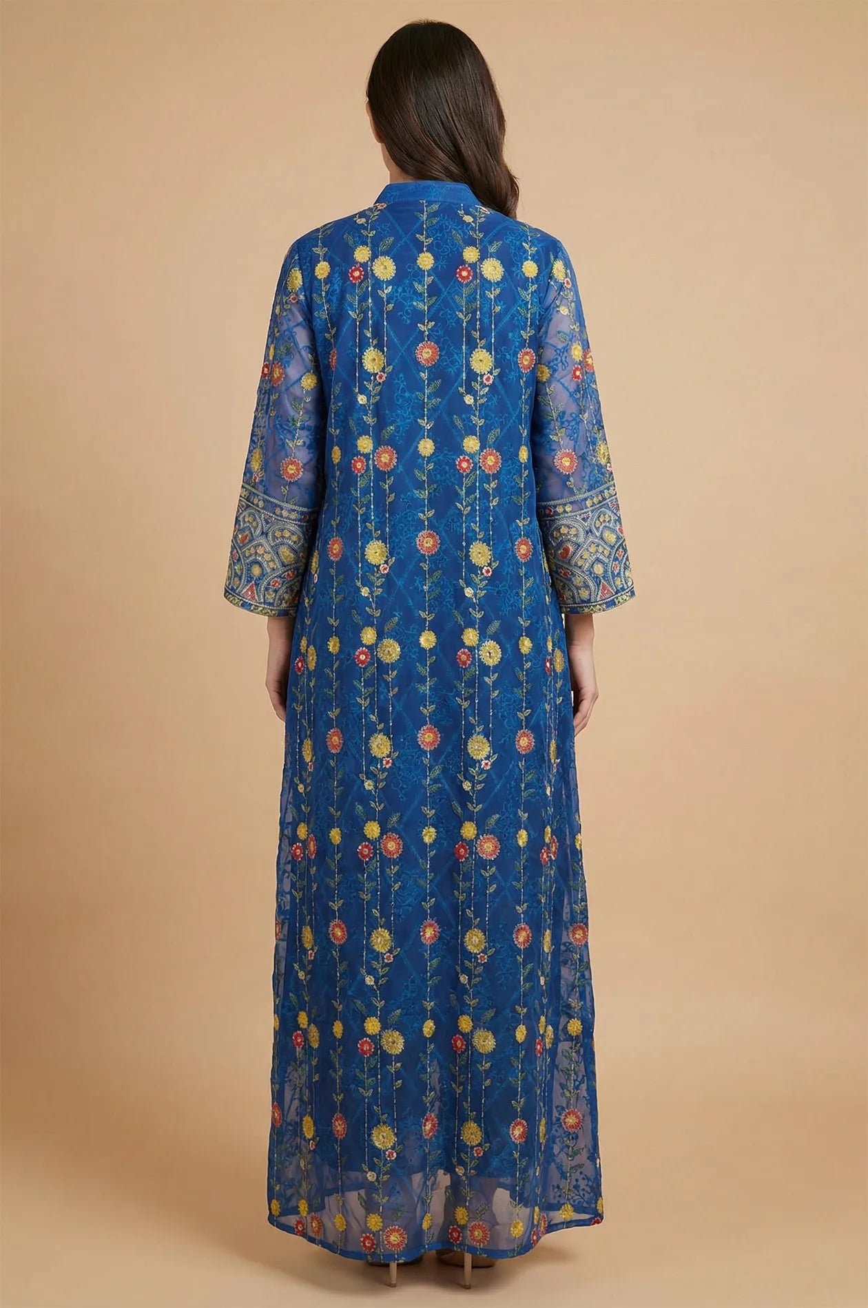Rear view of the Azari navy chiffon kaftan maxi dress highlighting the elegant vertical floral vine print and floor-length cut.