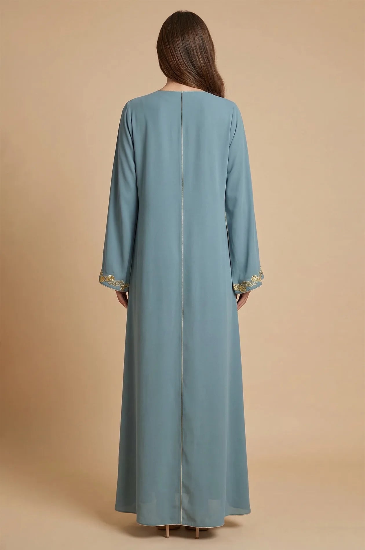 Back view of the blue Tahra kaftan showing the fluid fabric drape.