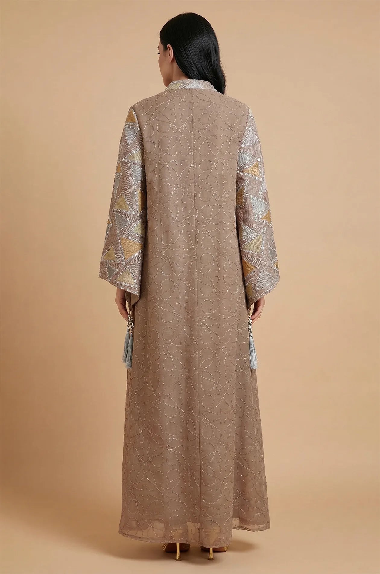 The back view of the Brown Kaliera kaftan, featuring all-over scrollwork embroidery and a floor-length modest silhouette.