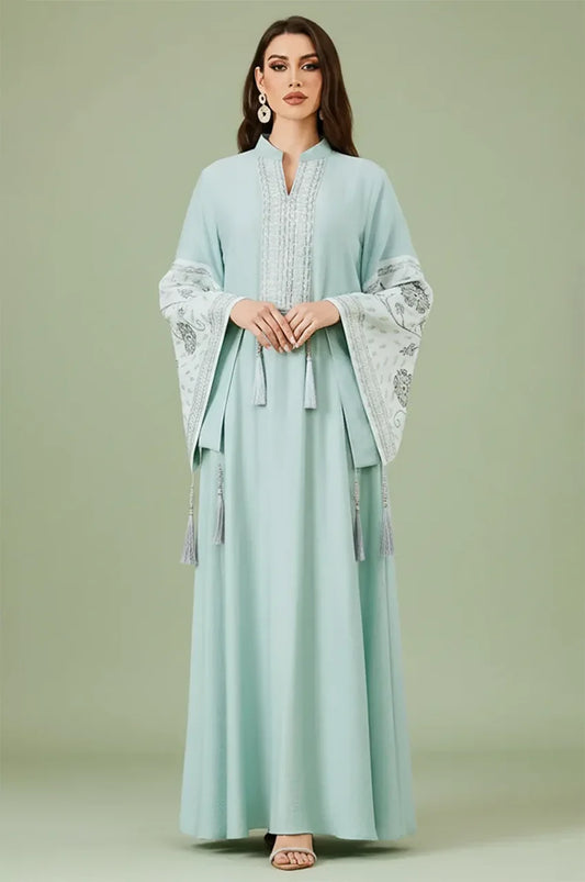 Professional studio front view of the Cyan Nairi cotton kaftan maxi with intricate white sfifa embroidery and bell sleeves.