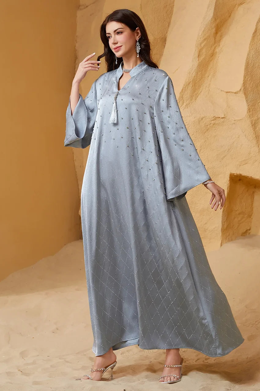 Lifestyle shot of Elani lavender gray kaftan showcasing the wide bell sleeve silhouette.