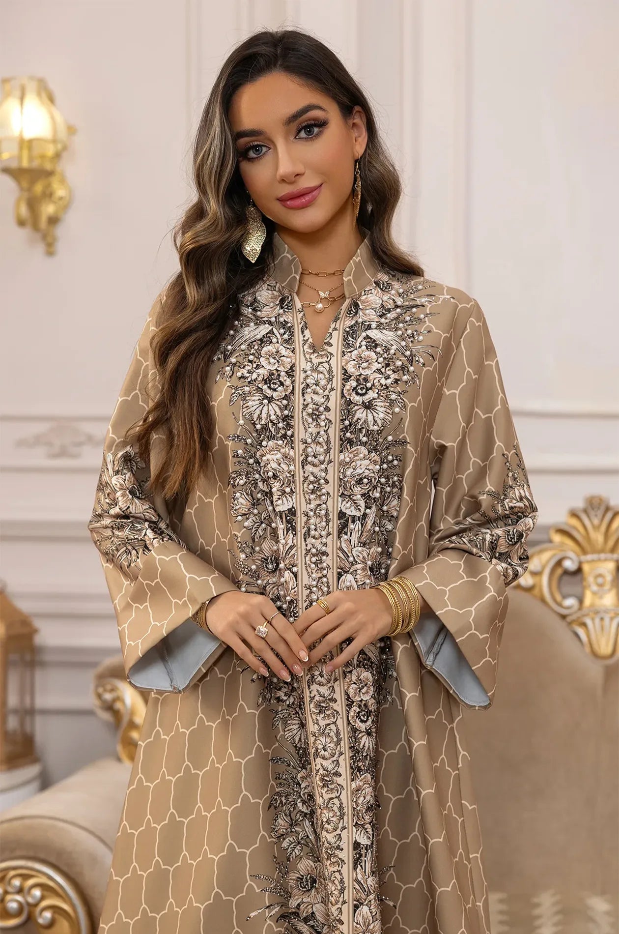 Detailed portrait highlighting the rhinestone-embellished floral patterns and bell sleeves of the Elora Beige kaftan.