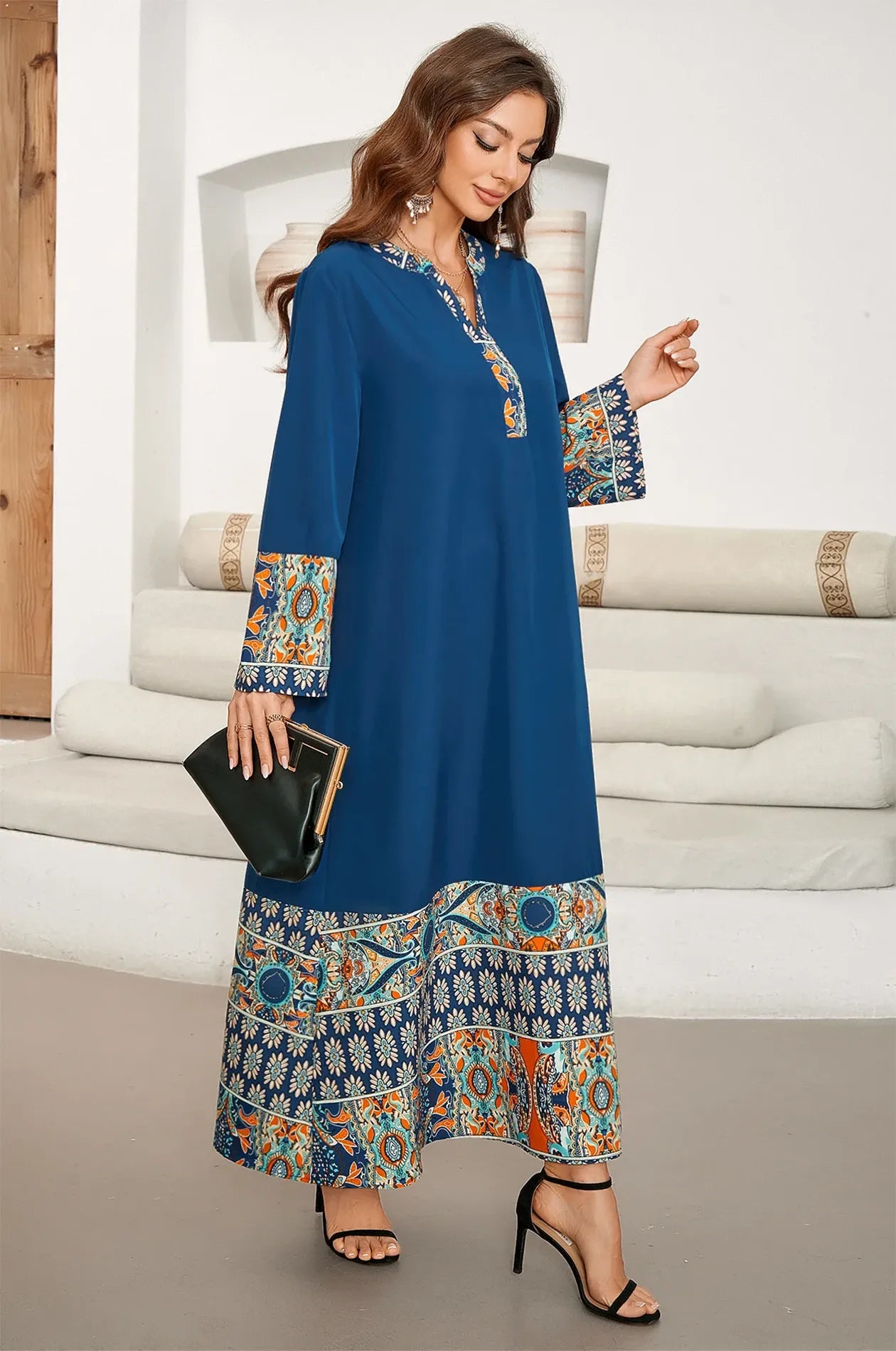 Model showcasing the flow and movement of the Elyah indigo kaftan