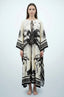Full length studio front view of Andra flamingo palm print kaftan