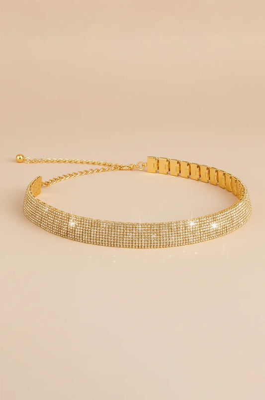 Side view of gold rhinestone belt showing the multi-row crystal setting.