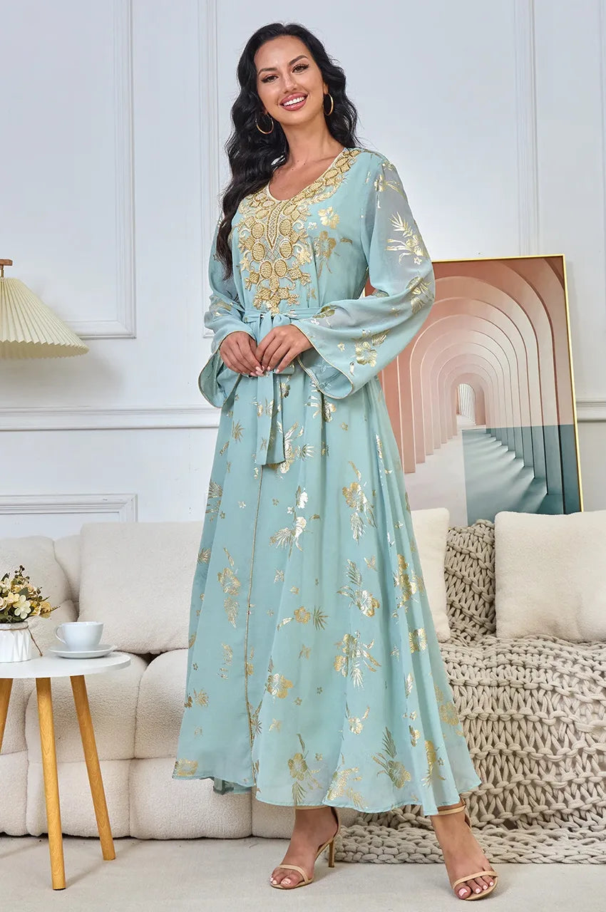 Close-up of the heavy gold embroidery and waist belt on the Malika Aqua moroccan evening dress.