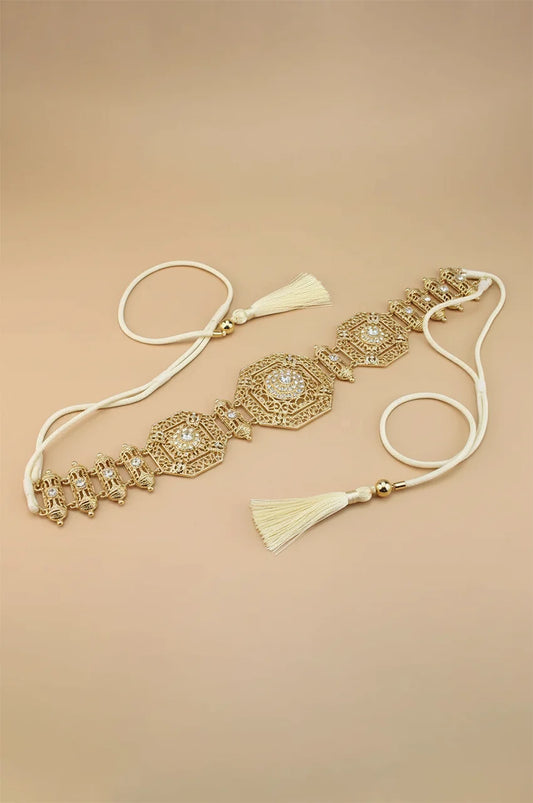 Angled view of the gold rhinestone belt highlighting the connecting links and adjustable cord.