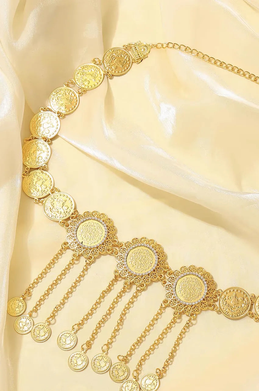 Angled view of the gold metal belt highlighting the link construction and shine.