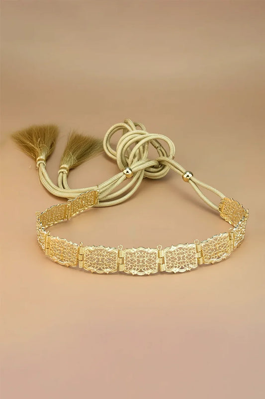 Full view of the gold square filigree belt with adjustable braided rope ties and tassels.