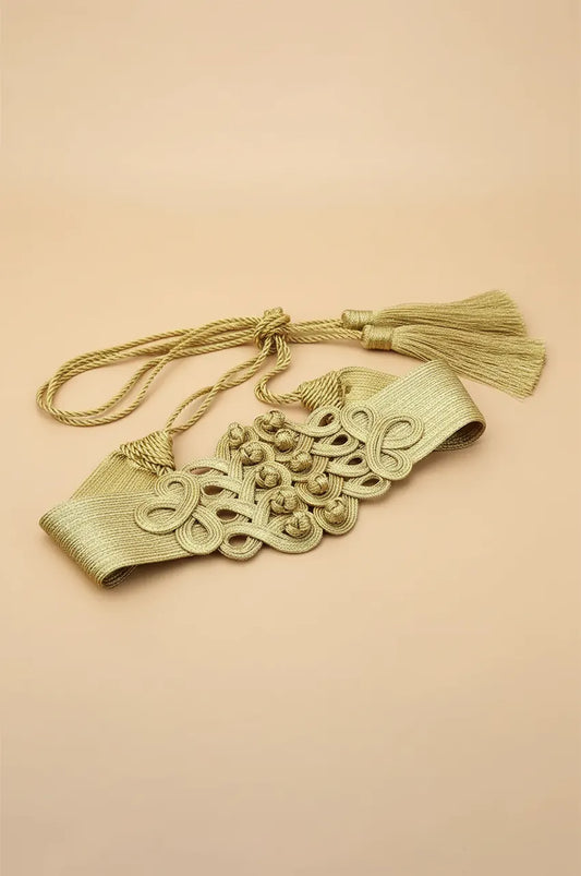 Full view of gold braided cord sash belt with tassel ties on a neutral background.