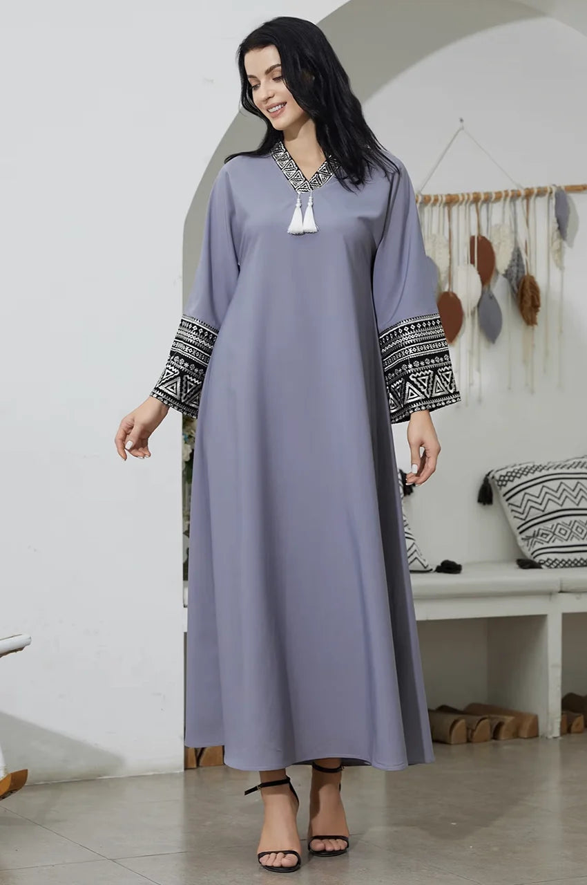 Flowing fabric of the Keyla gray kaftan dress in motion.