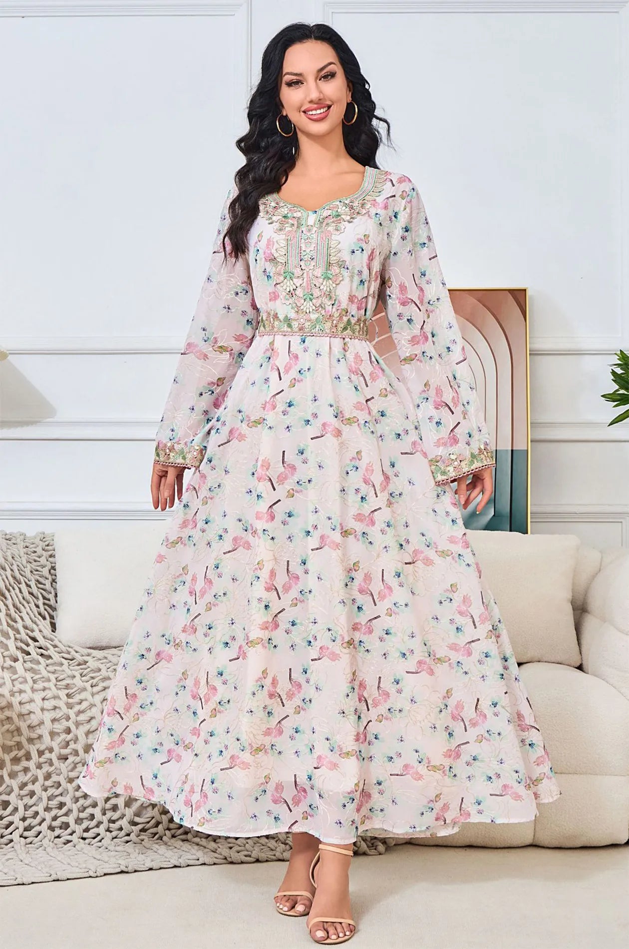 Wide shot focusing on the flared floor-length hem of the Ilani floral gown.