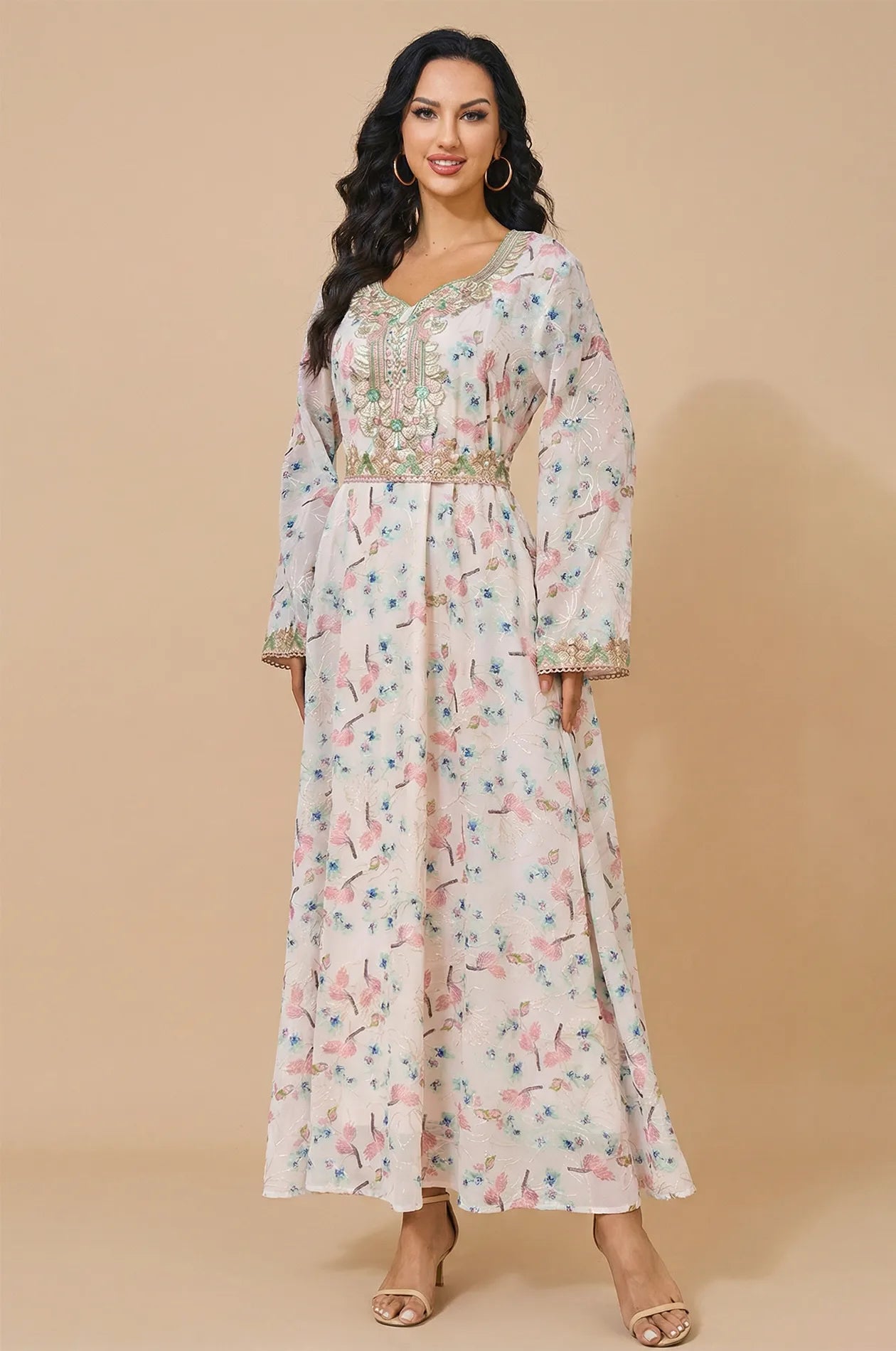Full front view of the Ilani blush pink kaftan with floral prints and gold embroidery.
