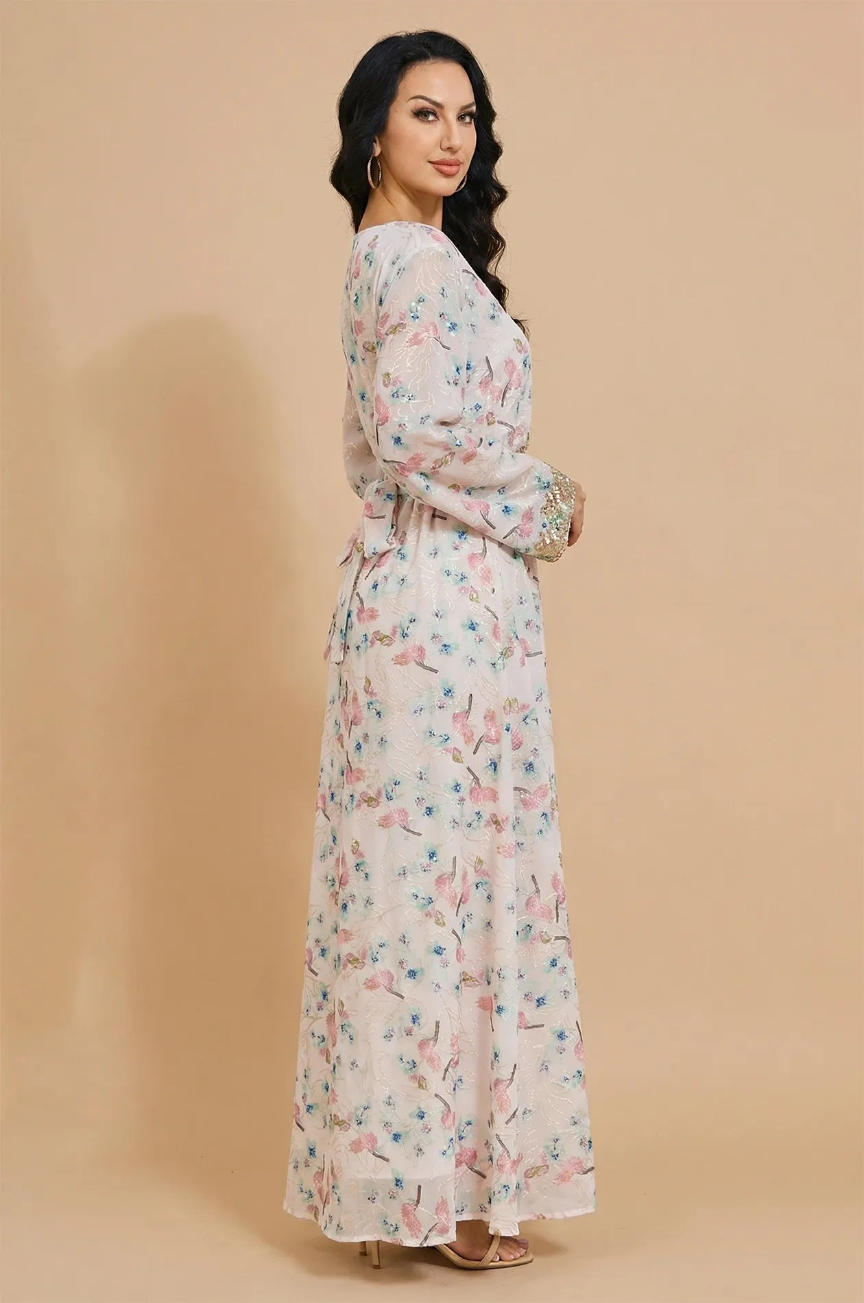 Side profile of the Ilani floral kaftan highlighting the flowing sleeve and silhouette.