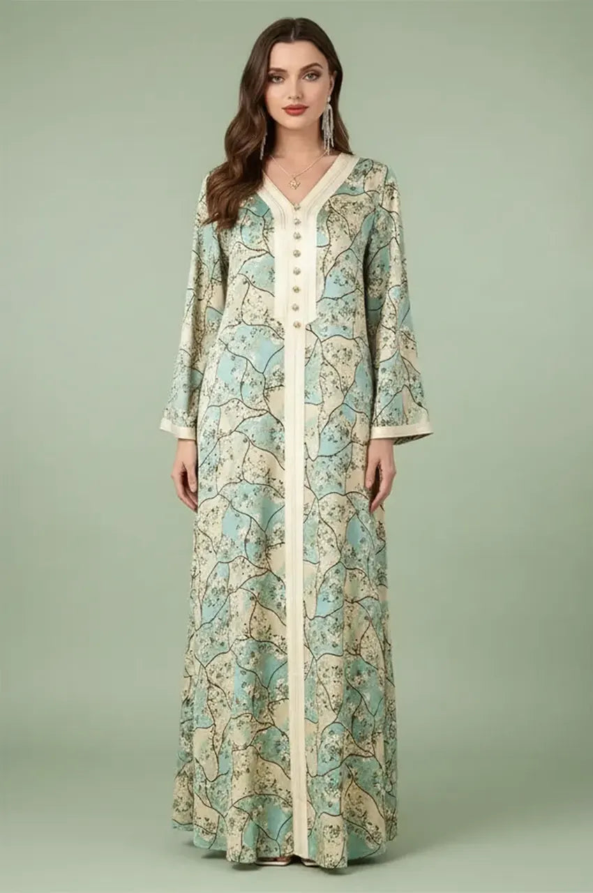 Full front view of the Isara green casual Moroccan kaftan with floral print and ivory Sfifa trim on a studio background.