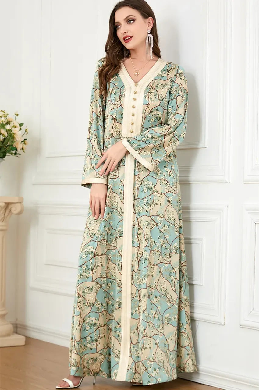 Three-quarter view of the Isara green floral print kaftan, suitable for casual social gatherings and modest chic styling.