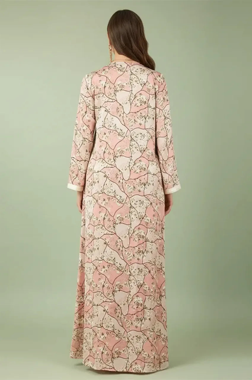 Back view of the Isara pink casual Moroccan kaftan showing the continuous floral pattern and maxi silhouette.
