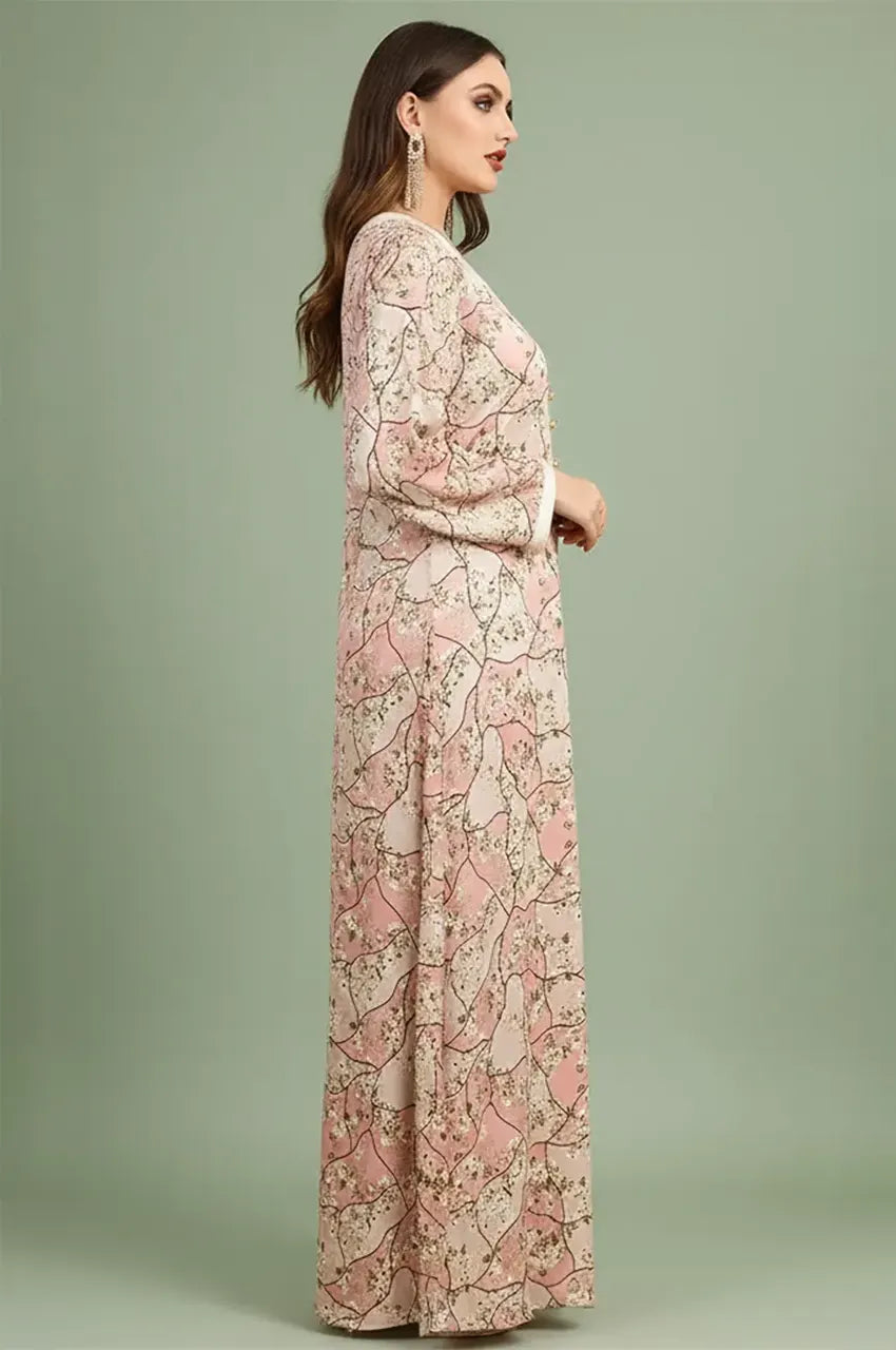Side profile of a model wearing the Isara pink casual Moroccan kaftan with long sleeves and modest fashion design.