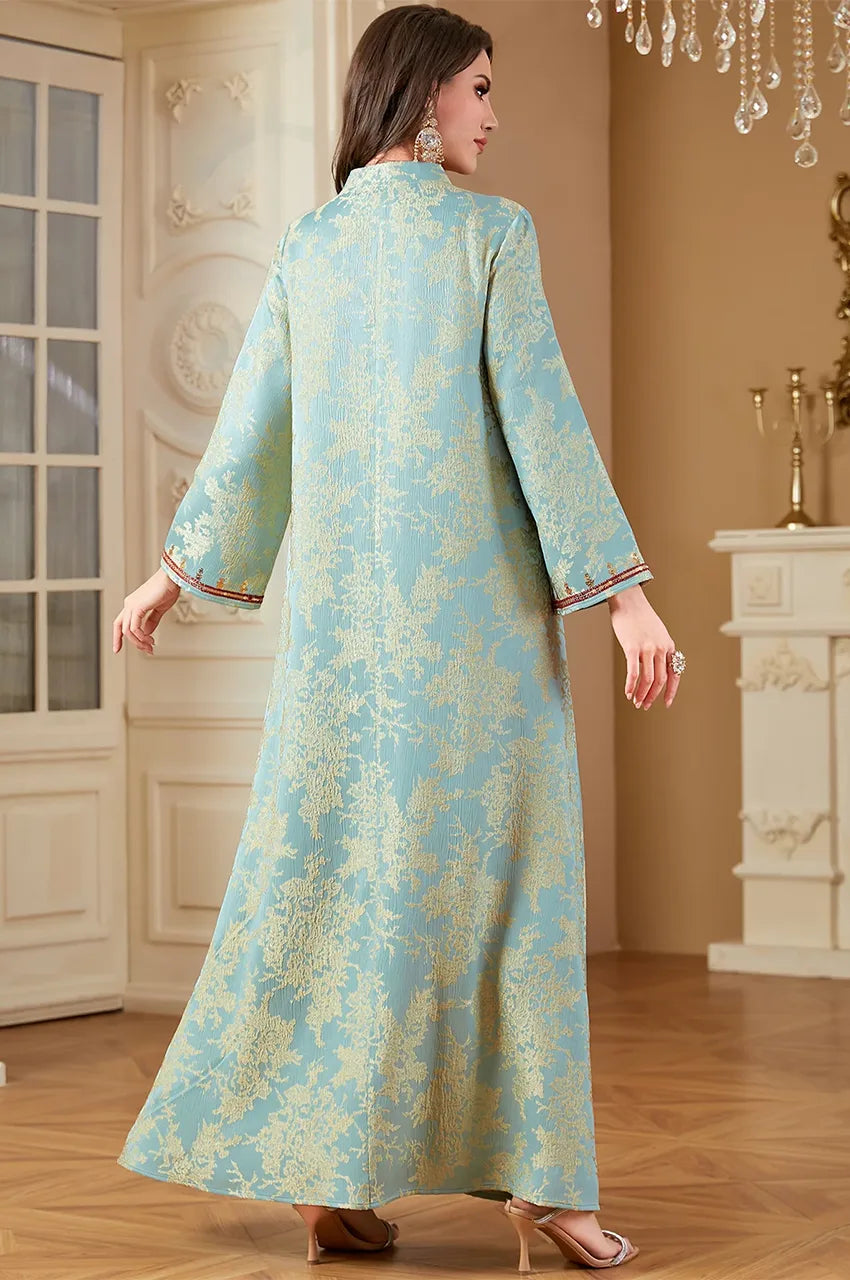 Rear angle view focusing on the gold floral woven pattern of the mint jacquard fabric.