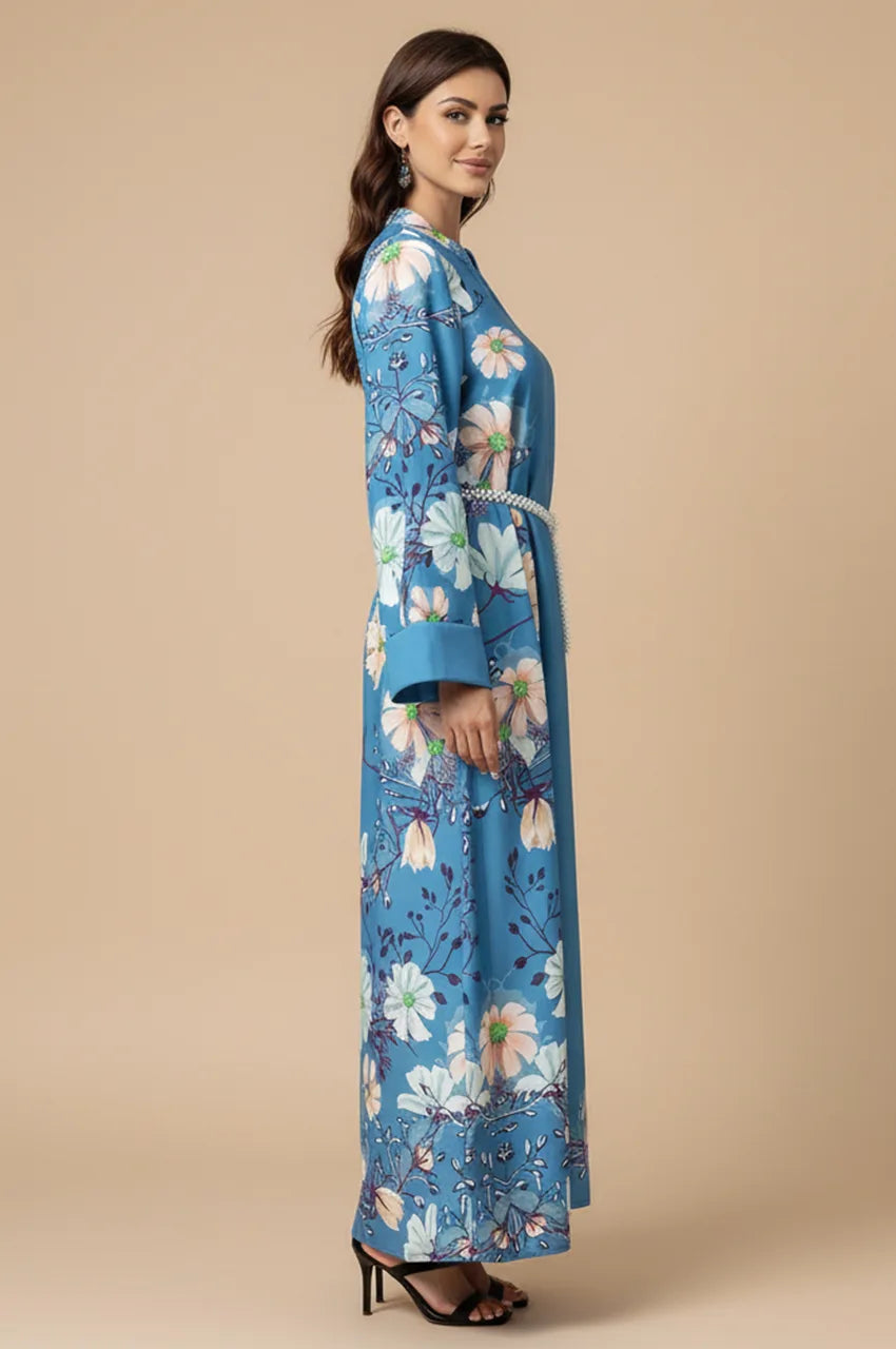 Side profile of modest sky blue kaftan showing sleeve cuffs and silhouette.