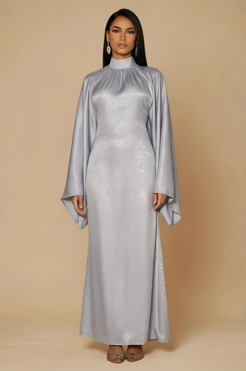 Front view of Kehlia metallic silver kaftan with high neck and fluid long sleeves