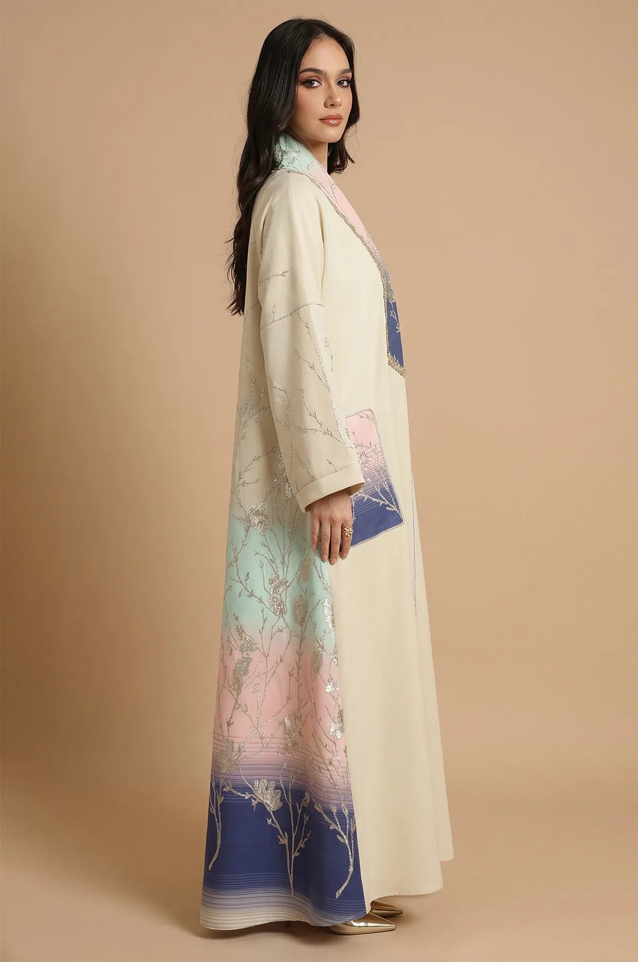 Side profile of the Liorra Dark Blue Kaftan Ombre displaying the wide sleeves and the elegant flow of the ombre fabric.