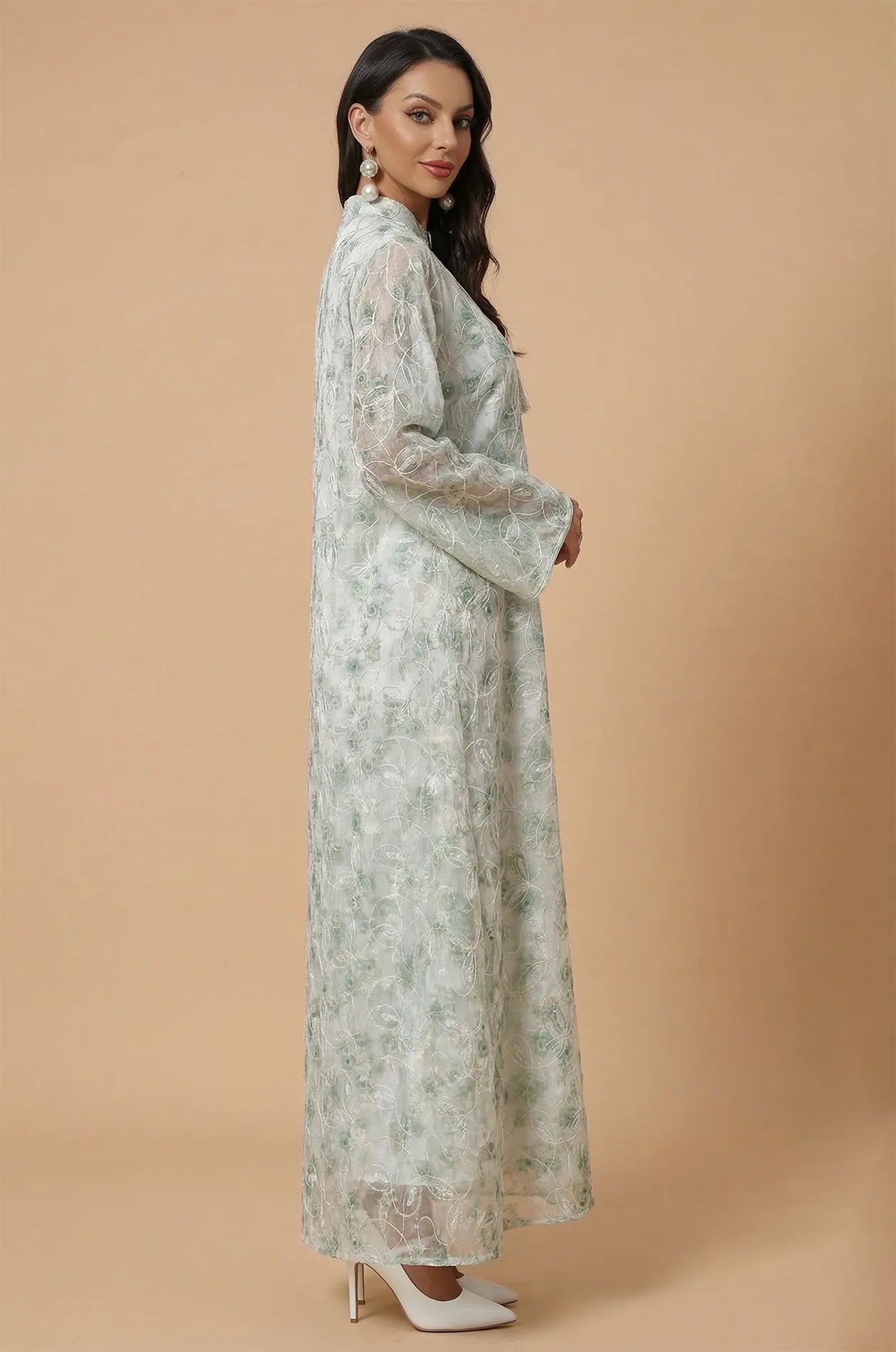Side profile of the Lyana kaftan highlighting the flared sleeves and floor-length cut.