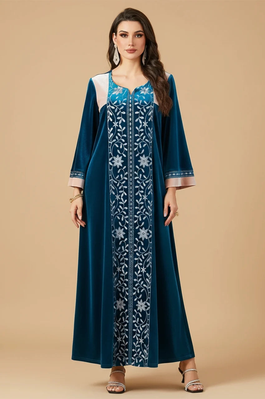 Studio shot of model wearing Lylah blue velvet kaftan showing full length fit.
