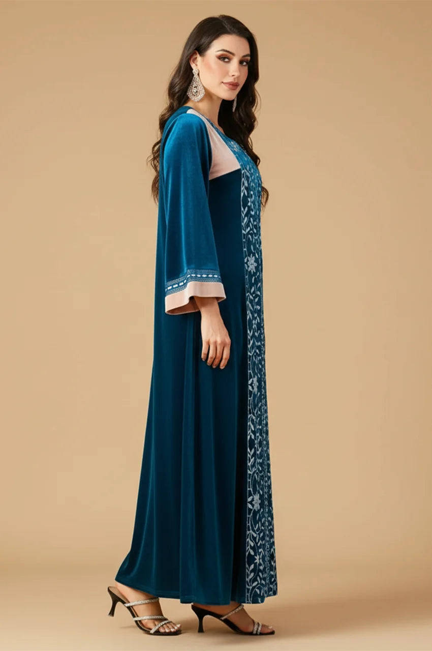 Side profile of Lylah kaftan highlighting the sleeve length and velvet texture.