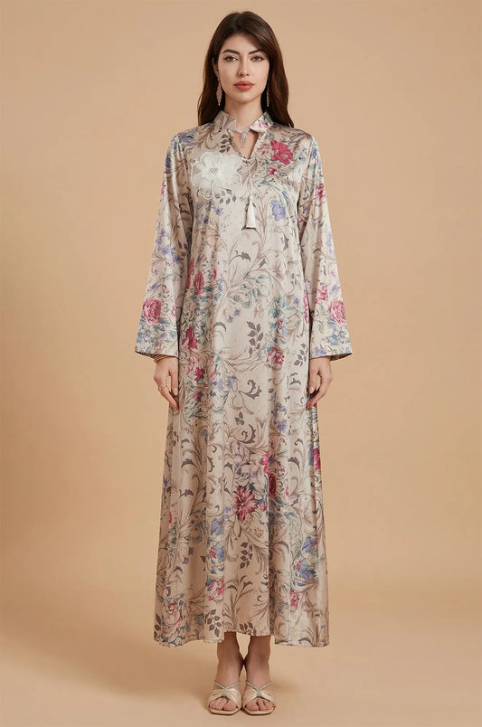 Front portrait of the Lyris satin kaftan showing the modest silhouette and floral pattern.