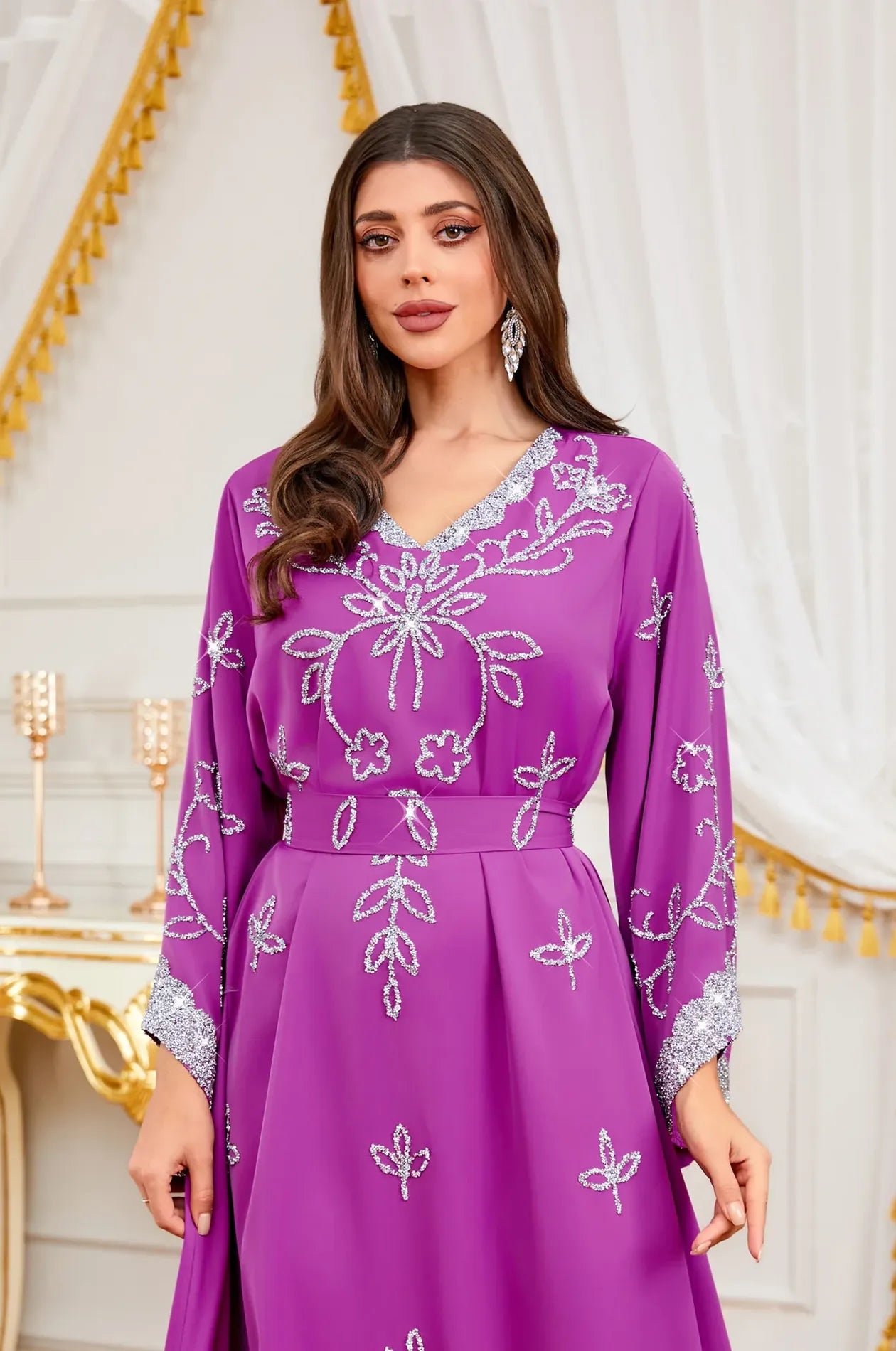 Close-up of the V-neckline and shimmering silver floral embroidery on the premium Magenta Maya Kaftan.