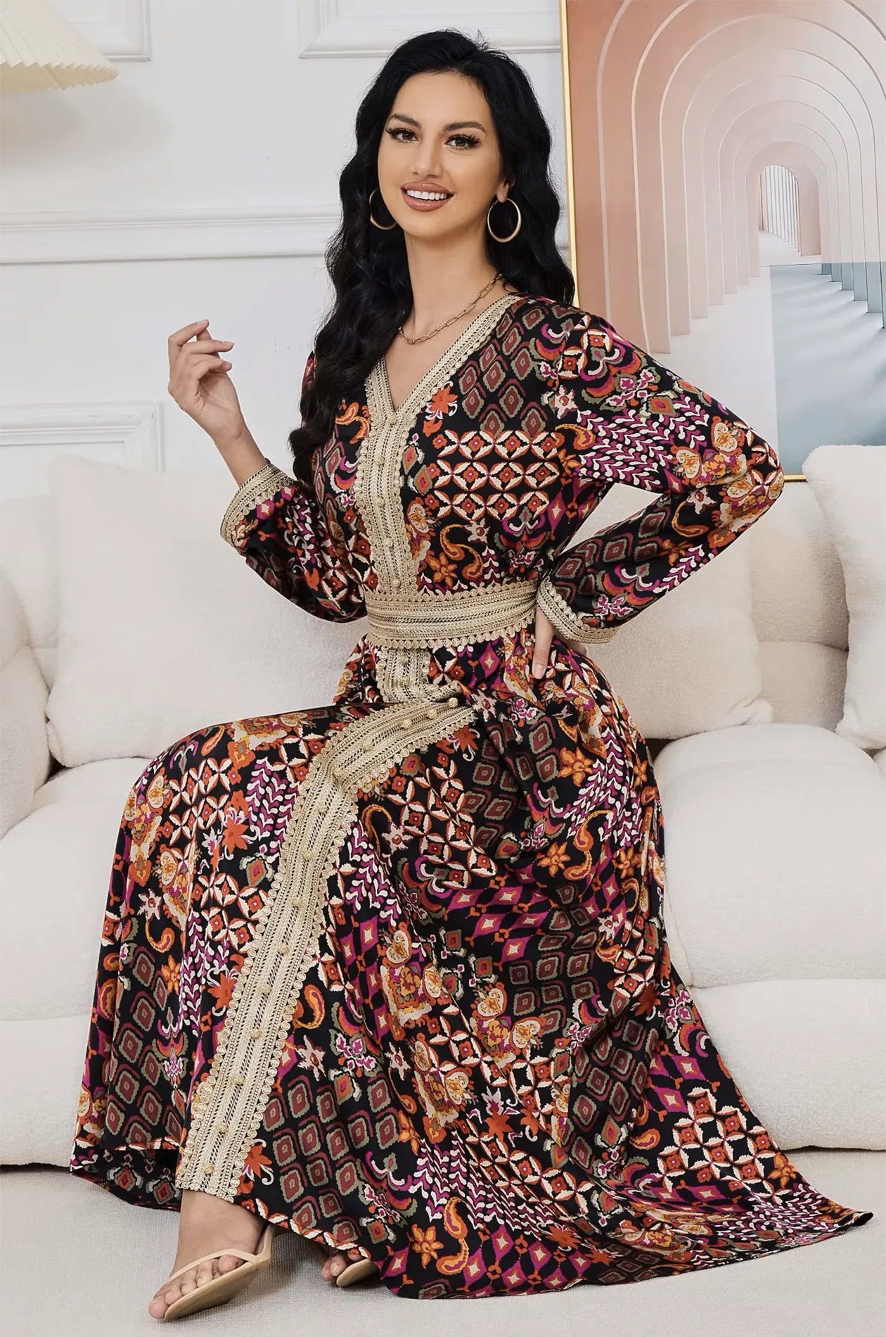 Detail of the intricate ethnic print on the Maris kaftan while seated.