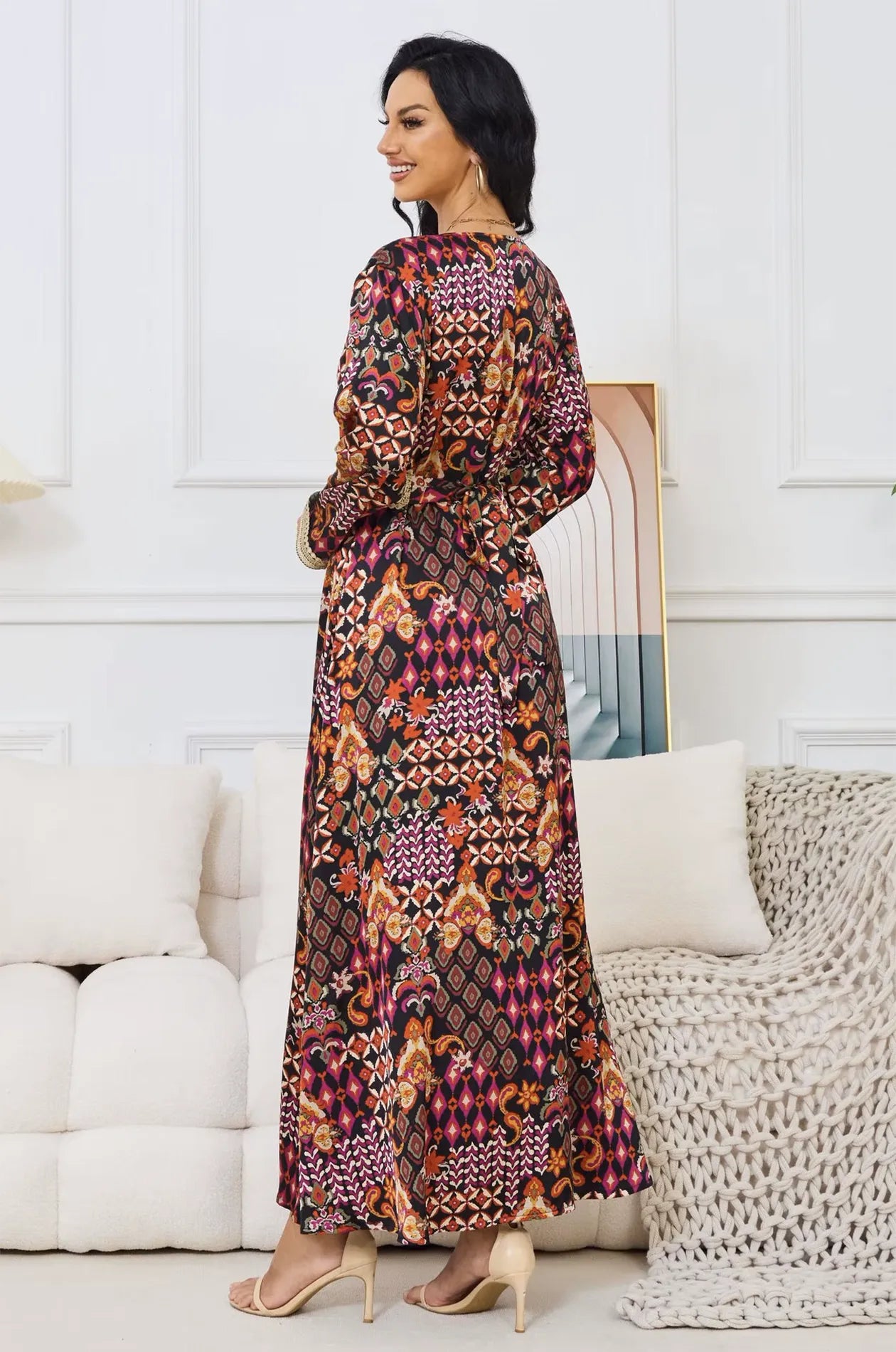 Close-up of the gold braided belt and tribal print on the Maris kaftan.