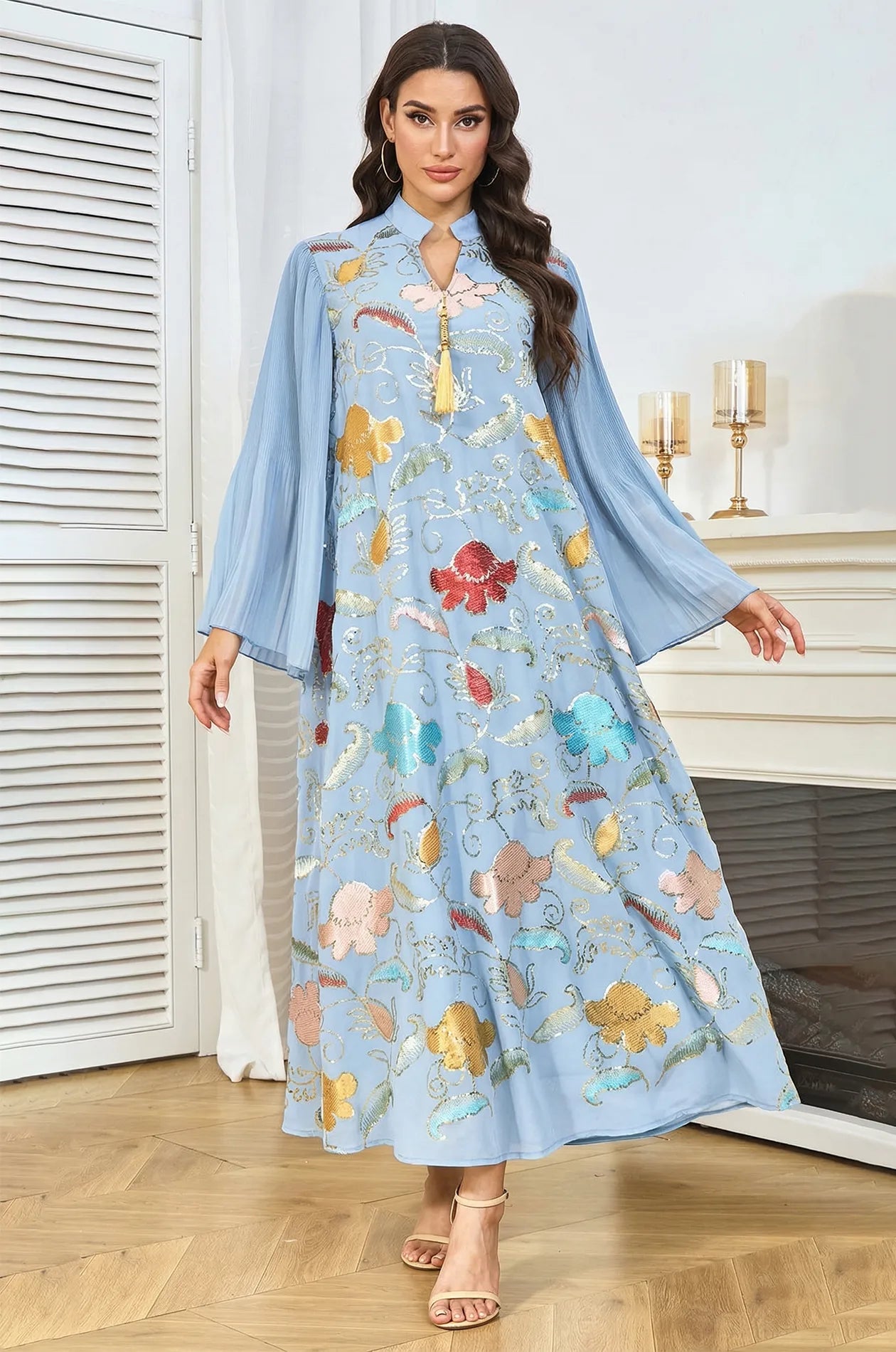 Full front view of the Light Blue Marylin Kaftan by Naylara, showing the intricate contrast of vibrant sequins on sky blue fabric.