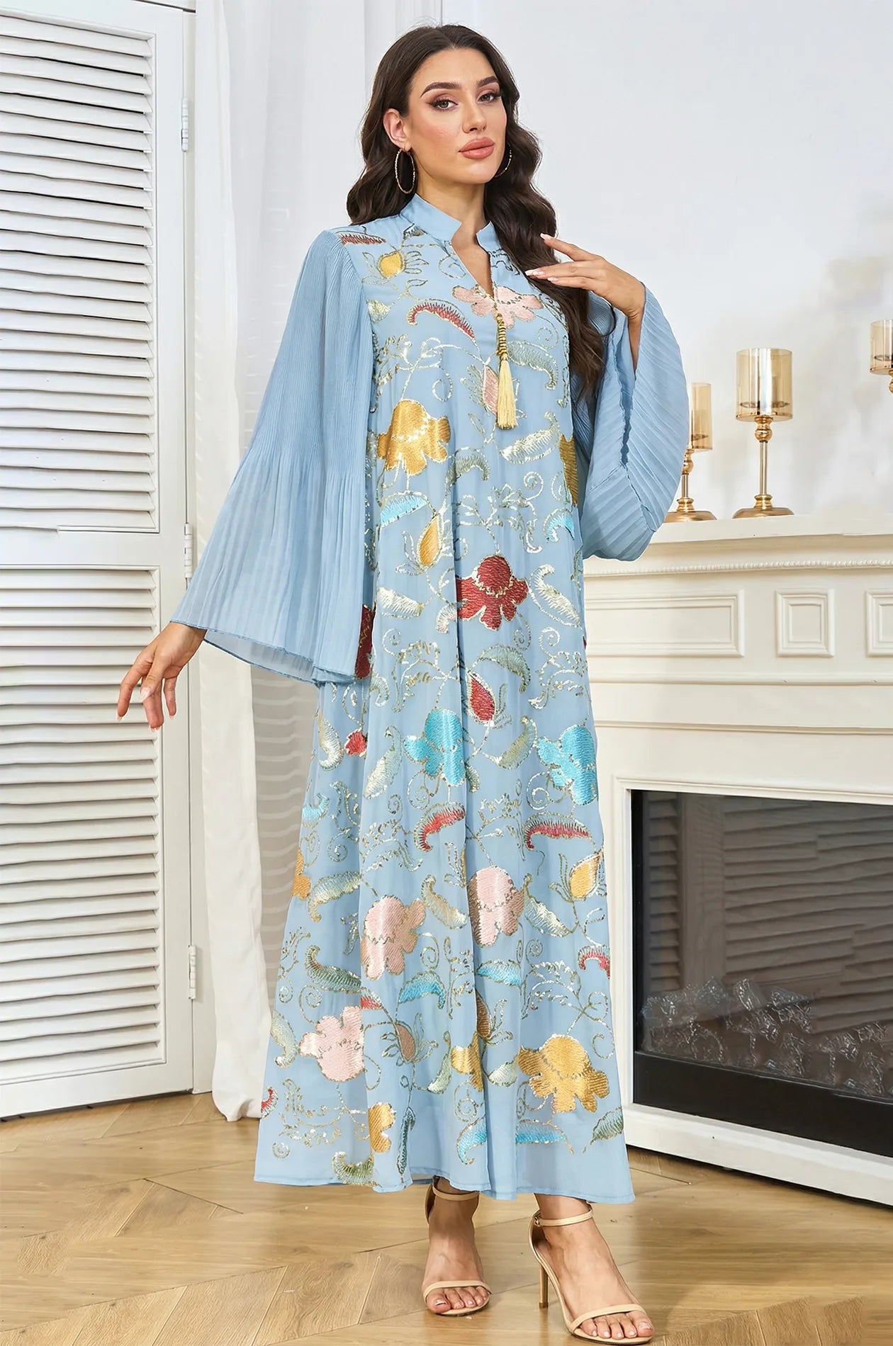 Elegant front pose of the Marylin Light Blue Tassel Kaftan featuring shimmering sequins and a signature gold tassel ornament.